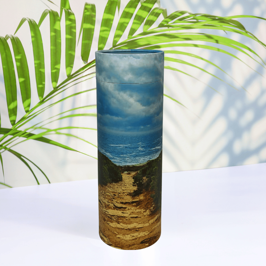 Scattering Tube with nature-themed design on a white surface with green leaves in the background