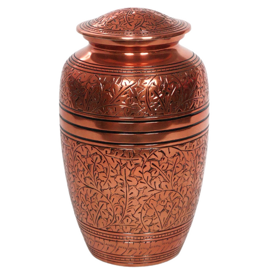 Brass urn in bronze colour with intricate etching details