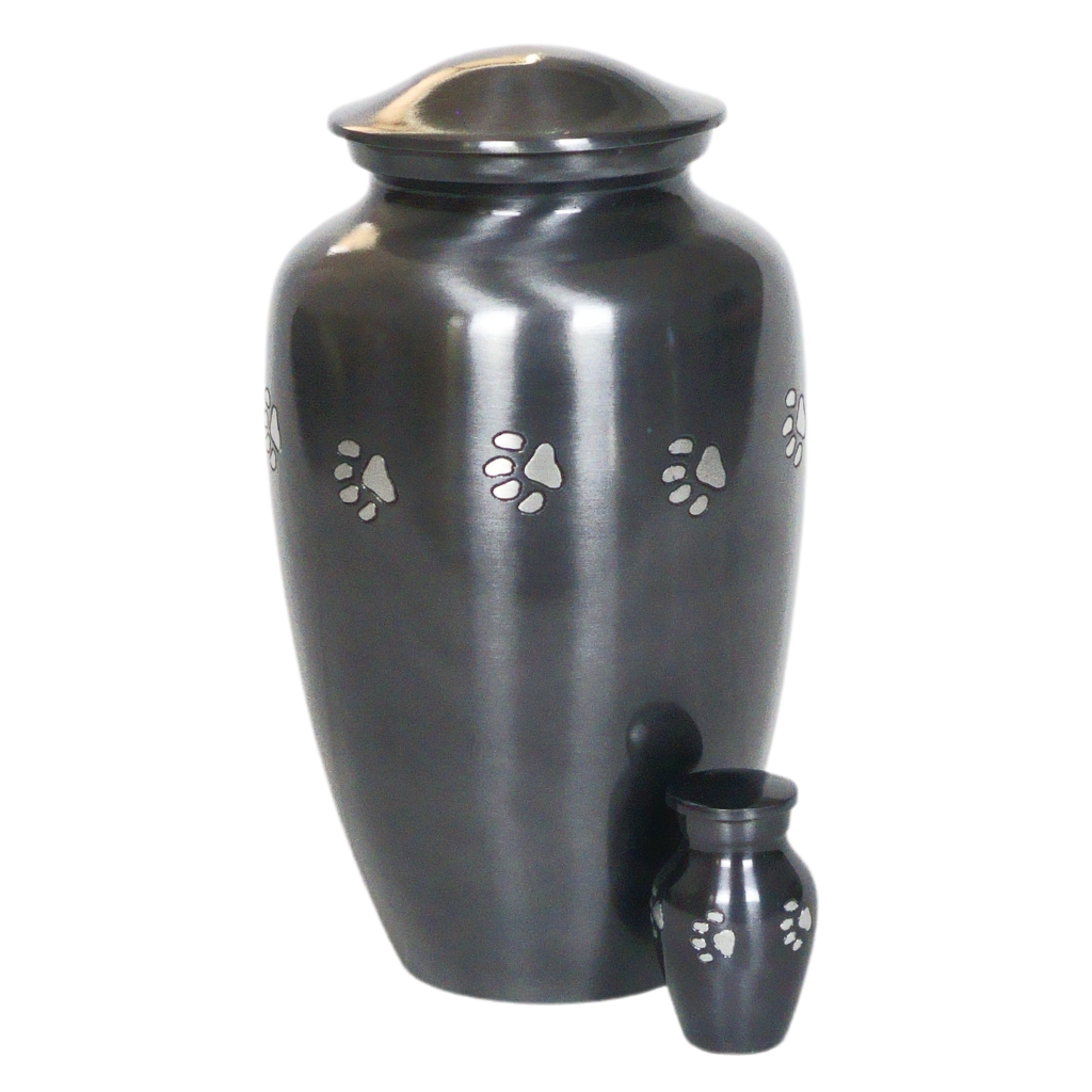 Classic style silver keepsake urn with etched pawprints next to matching full size urn