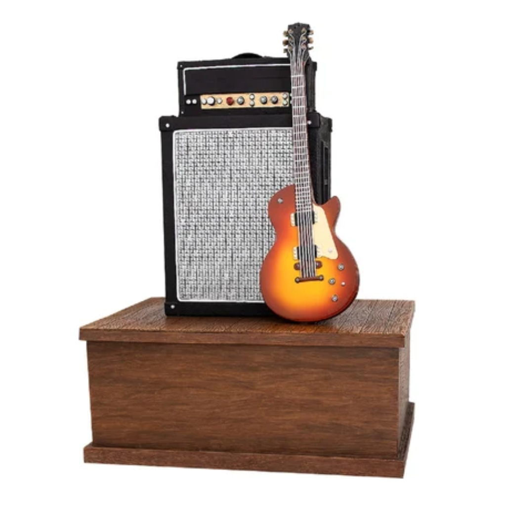 Wooden box urn with guitar and amp on top