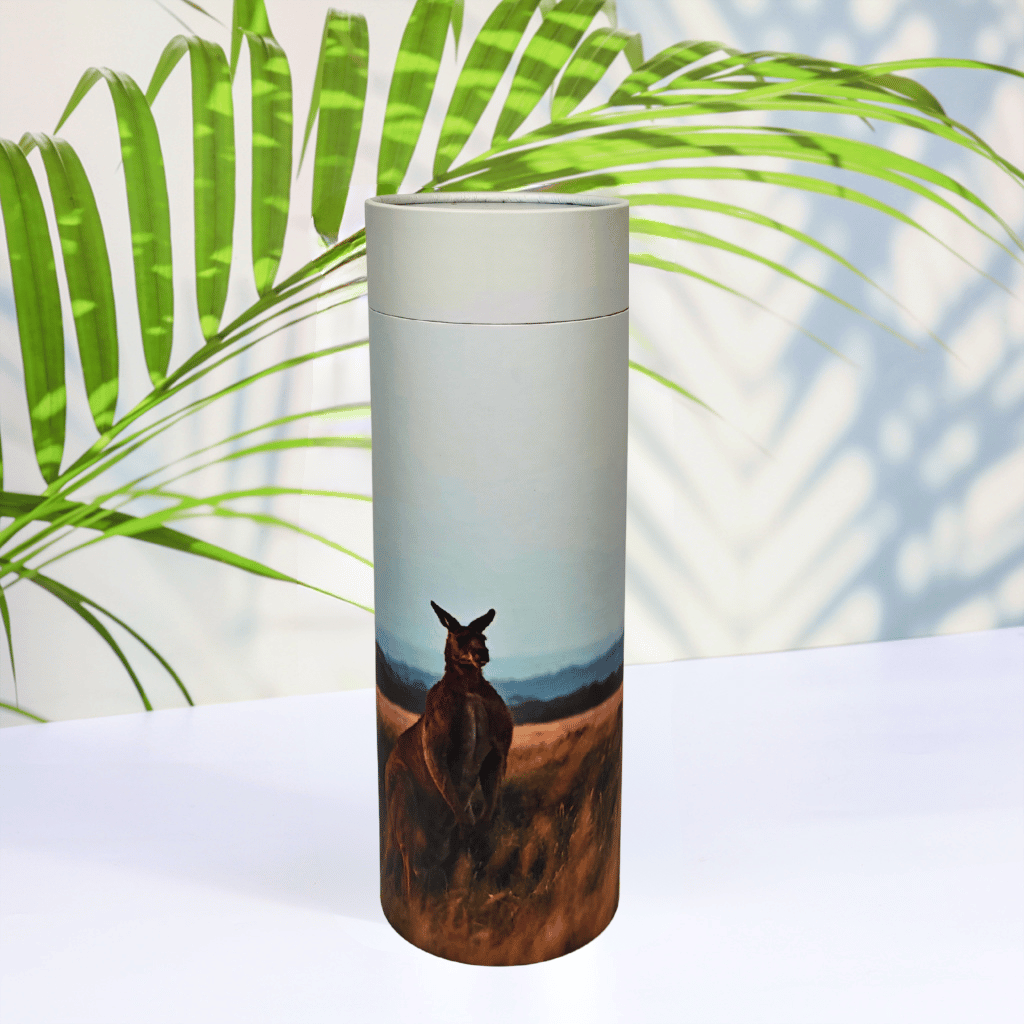 Scattering tube with a kangaroo design on a white surface with green leaves in the background