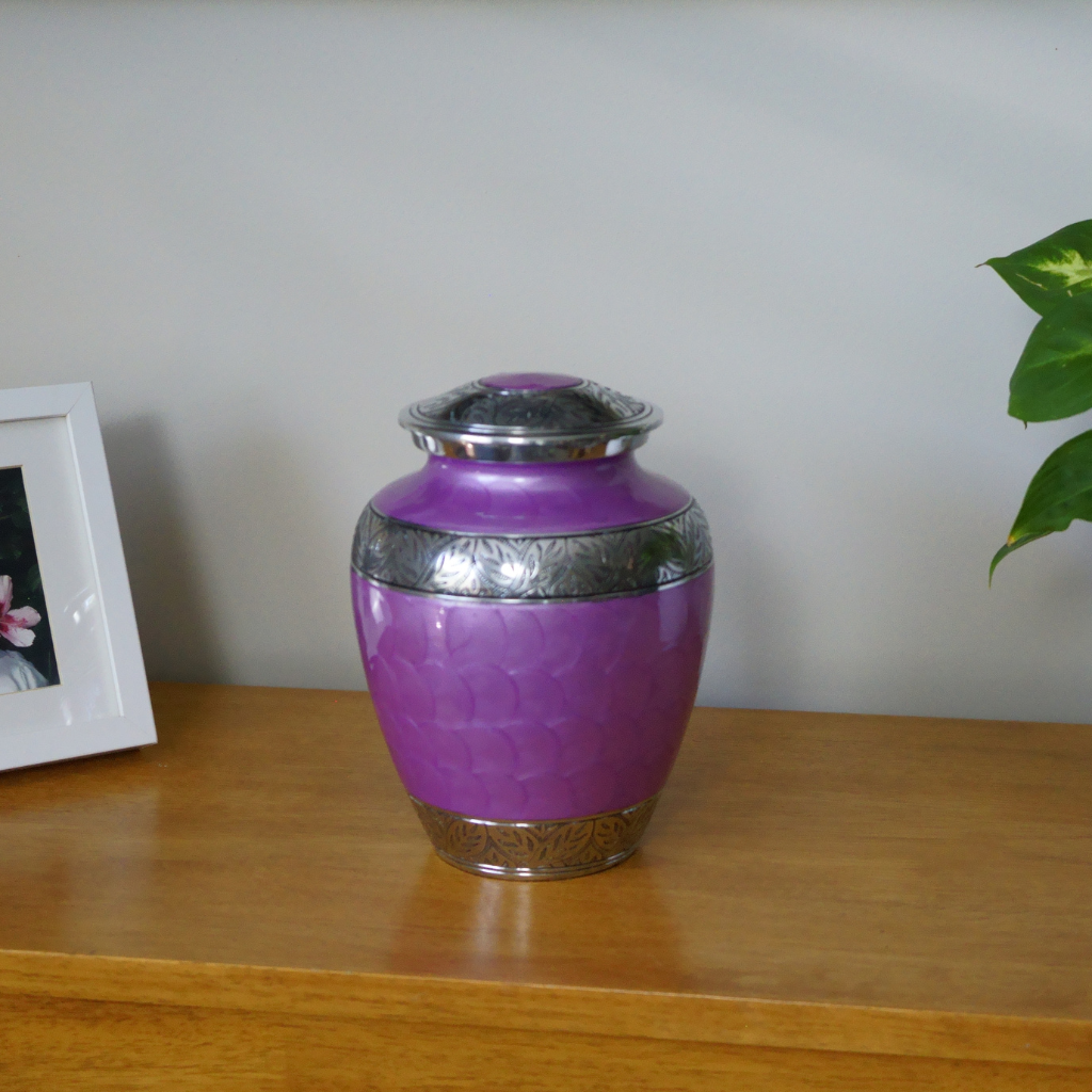 Purple soft scaled urn with silver leaf details in natural setting