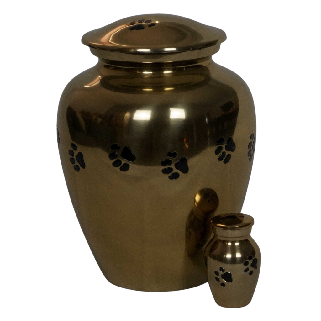 Gold keepsake urn with black etched pawprints next to matching full size urn