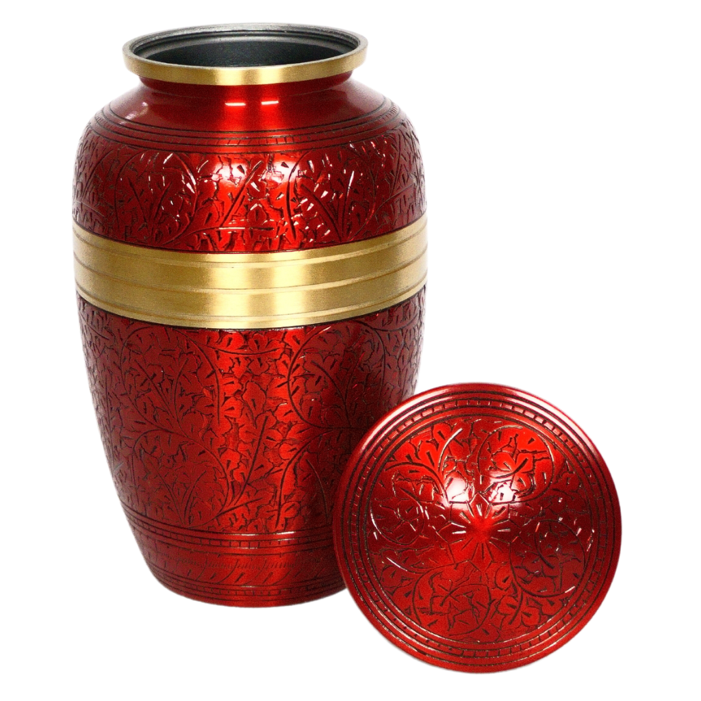 Red brass urn with intricate engravings and a gold detail lid off