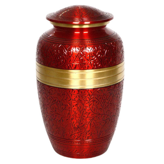 Red brass urn with intricate engravings and a gold detail