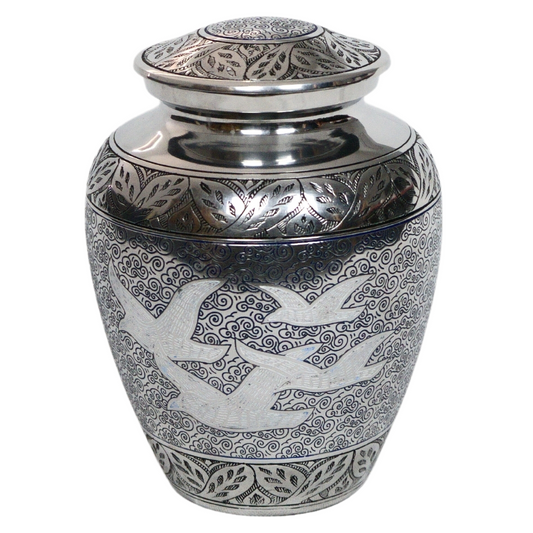 Silver urn with intricate cloud detailing and four prominent white birds etched