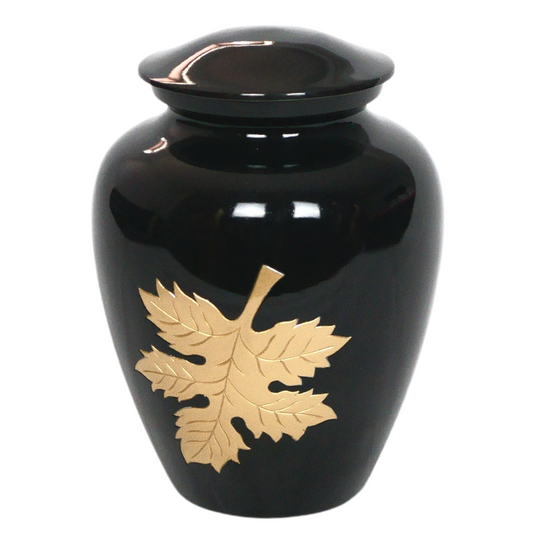 Black urn with gold autumn leaf etched